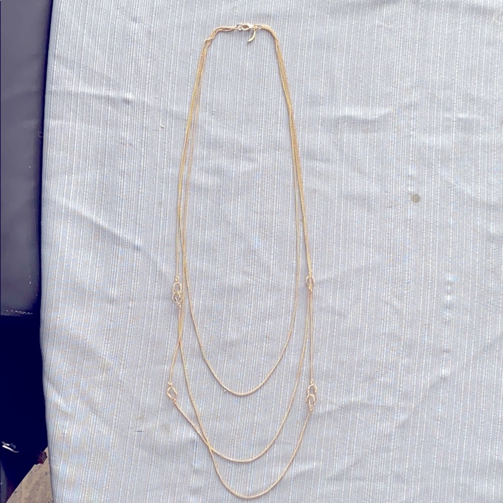 Gold 3 strand fashion necklace.
